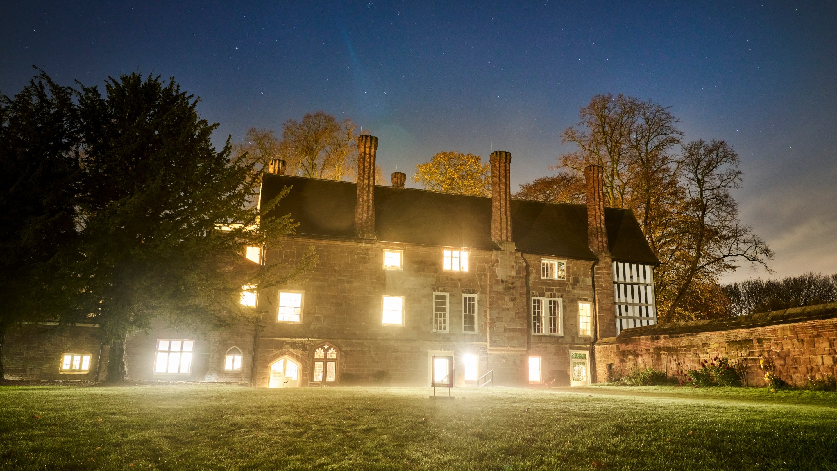 Warm light shining through the windows at Coventry Charterhouse