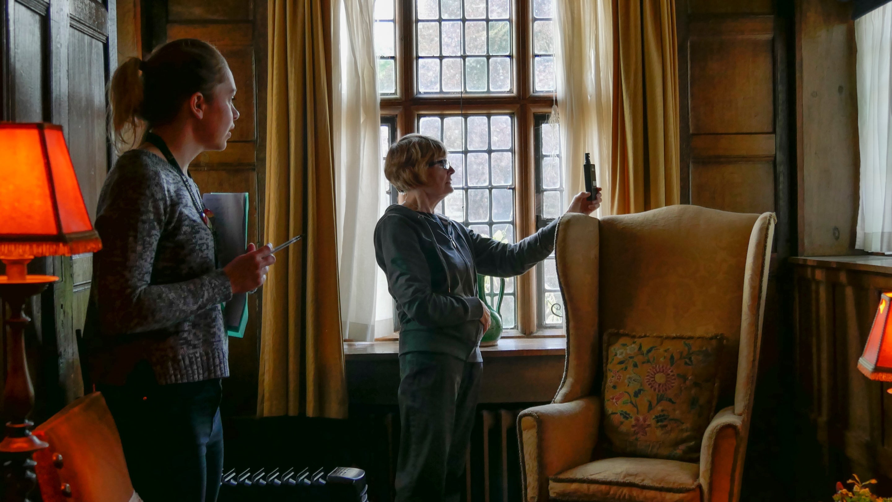 Conservators measuring the light levels in the Ireton Bedroom at Packwood House, Warwickshire