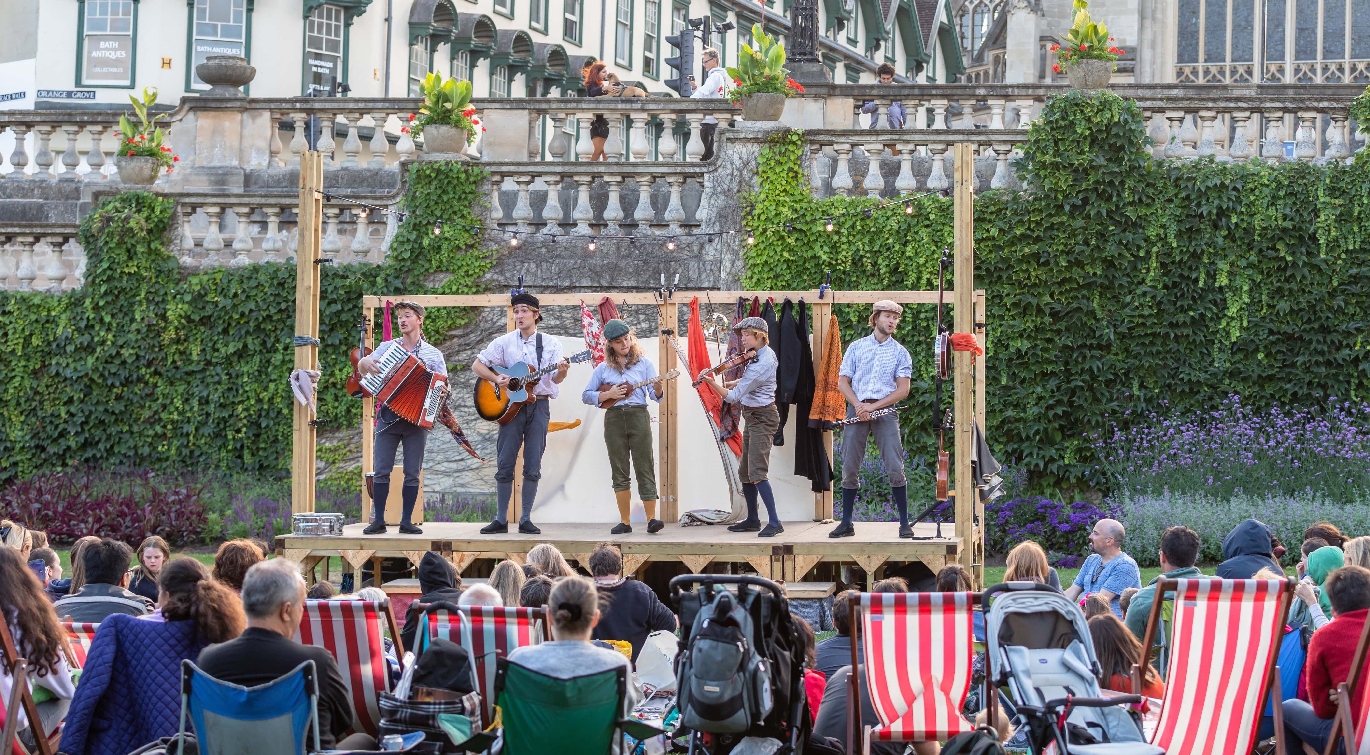 A view of the Three Inch Fools performing in the open air