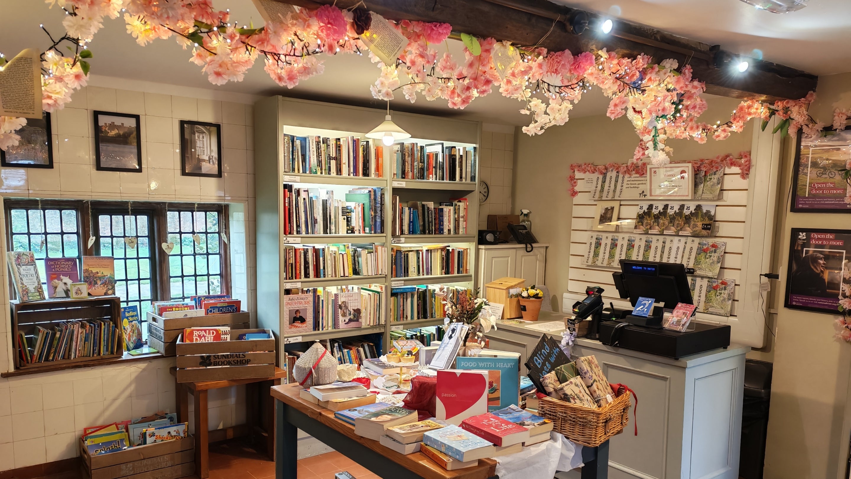 The Sundials second-hand bookshop at Packwood House, Warwickshire, with Bridgerton-themed decorations.