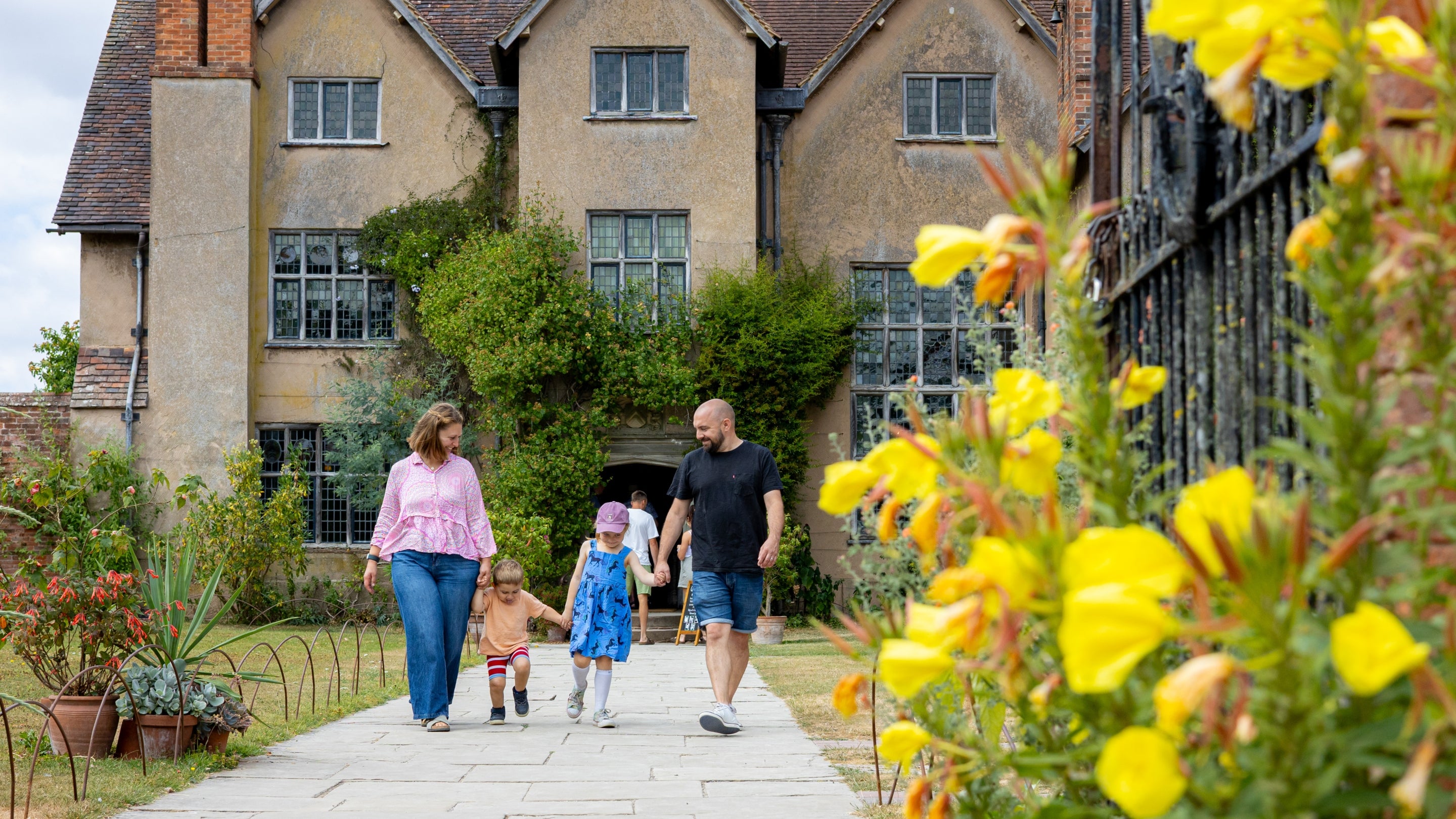 A family on their way out of Packwood House, Warwickshire