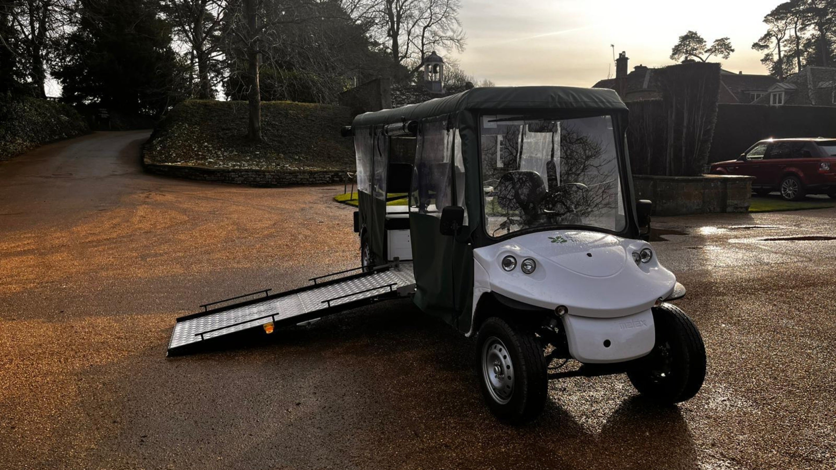 Buggy with wheelchair ramp down at the end of the main drive at Upton House