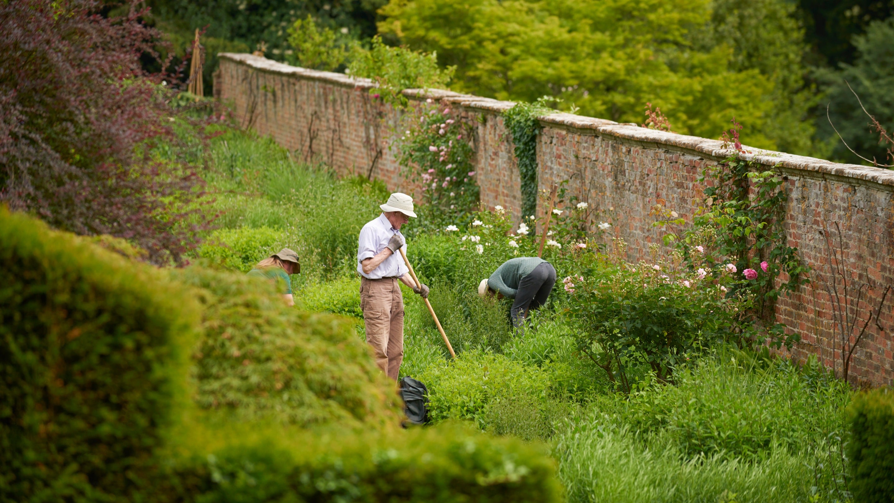 Volunteers working in the garden at Upton House, Warwickshire