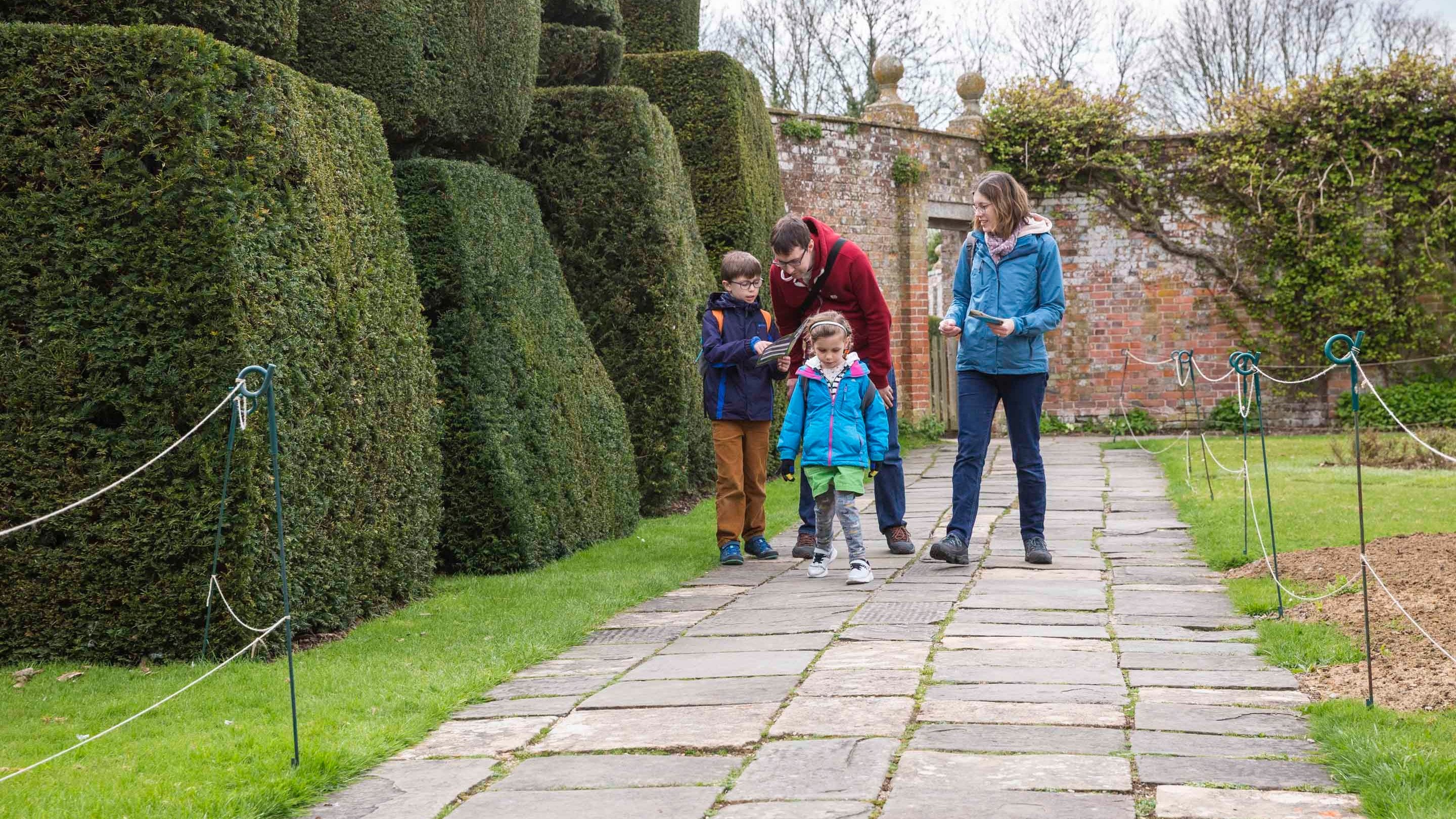 Family visiting the garden at Avebury Manor, Wiltshire