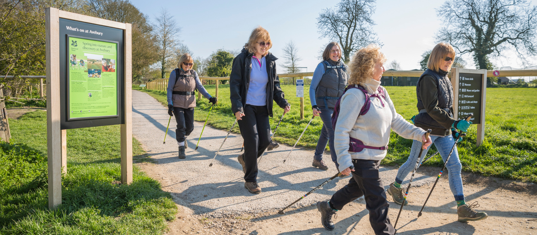 A group of women on a nordic walking trip on a footpath at Avebury.