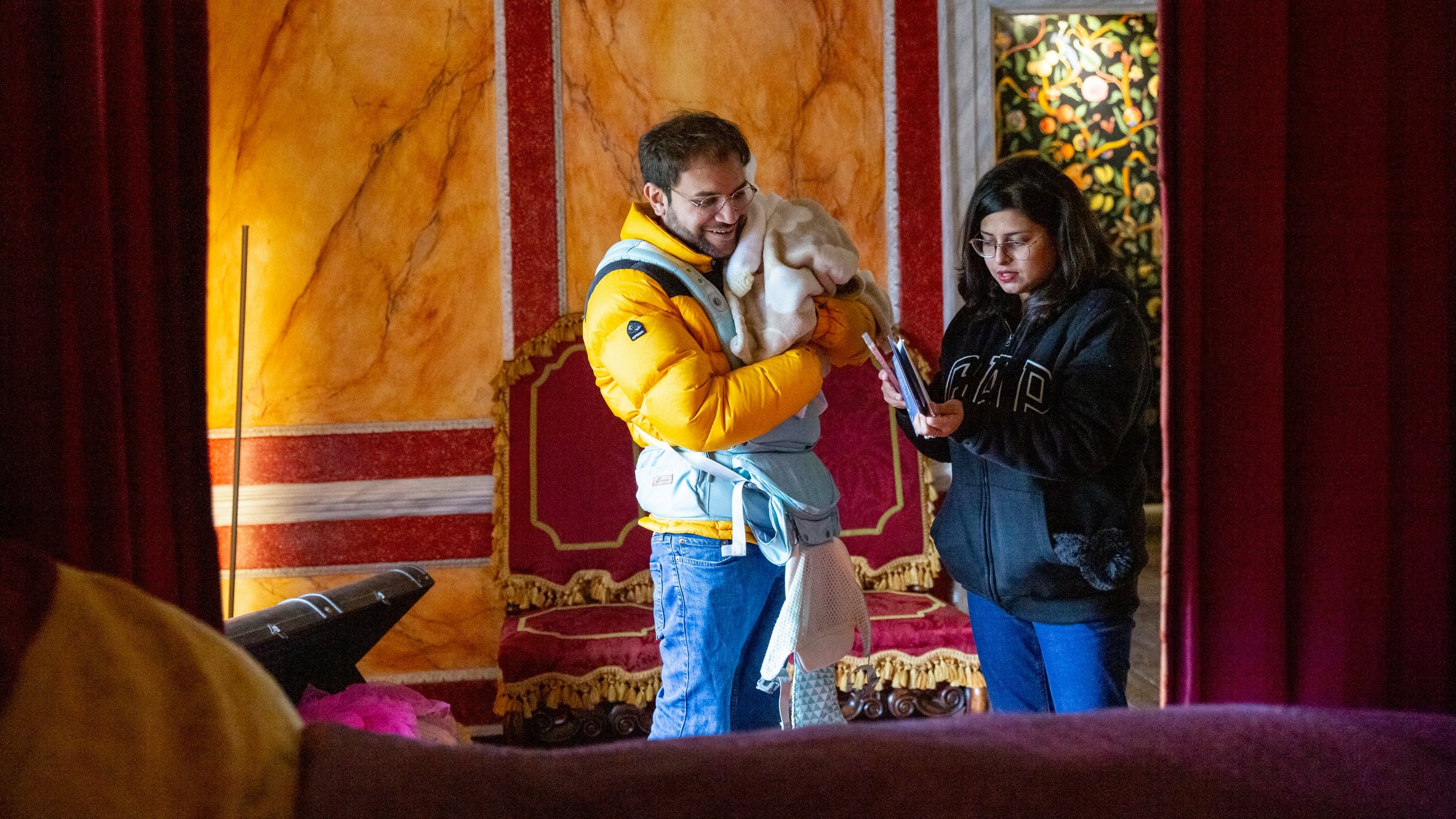 Visitors exploring the house at Christmas at Avebury Manor, Wiltshire