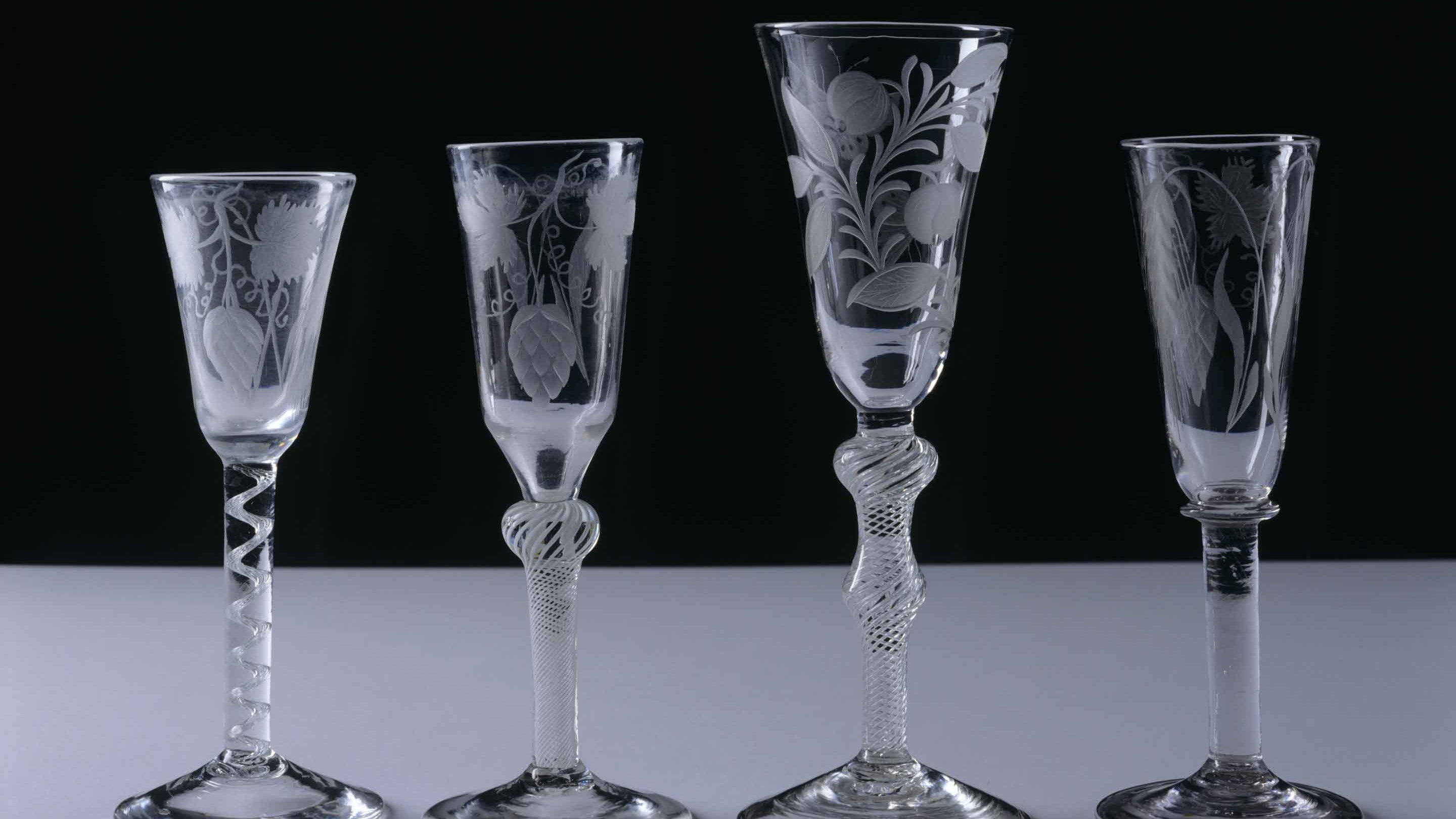 Collection of 18th-century drinking glasses displayed in the Dining Room at Mompesson House, Wiltshire
