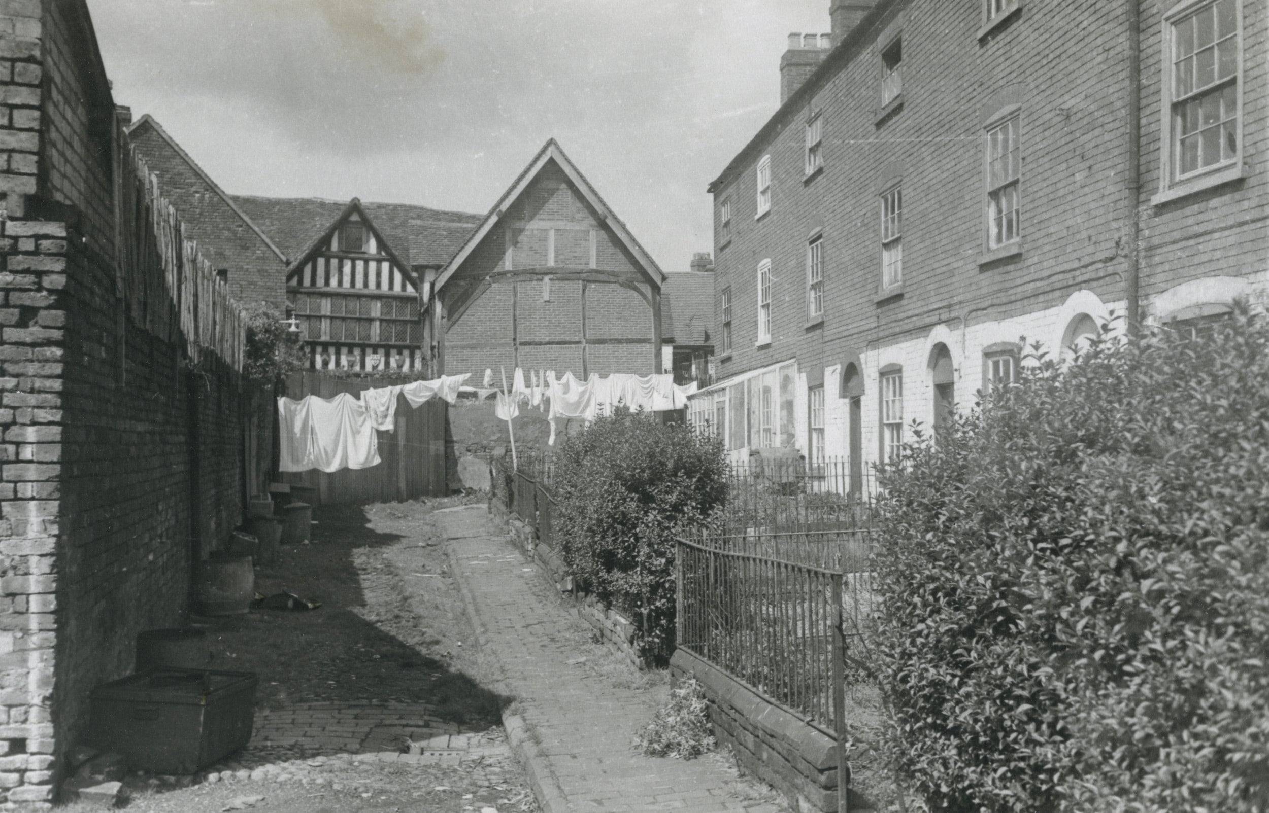 A black and white photograph showing the houses of St George's Yard at the rear of Greyfriars.