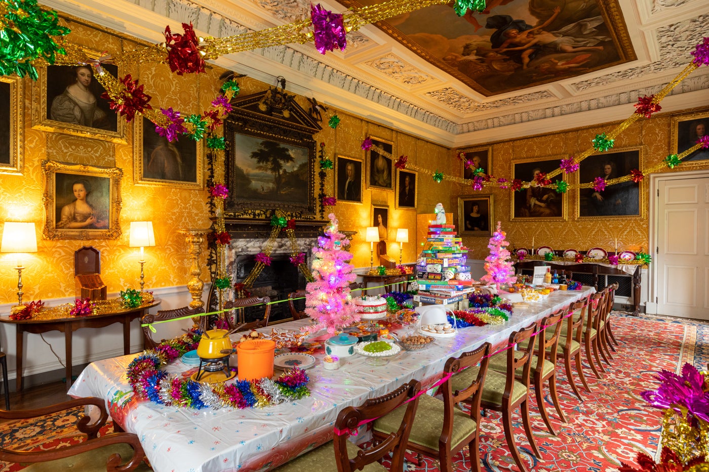 The Dining Room at Hanbury Hall decorated for a 70s and 80s Christmas with streamers and the table laden with party food