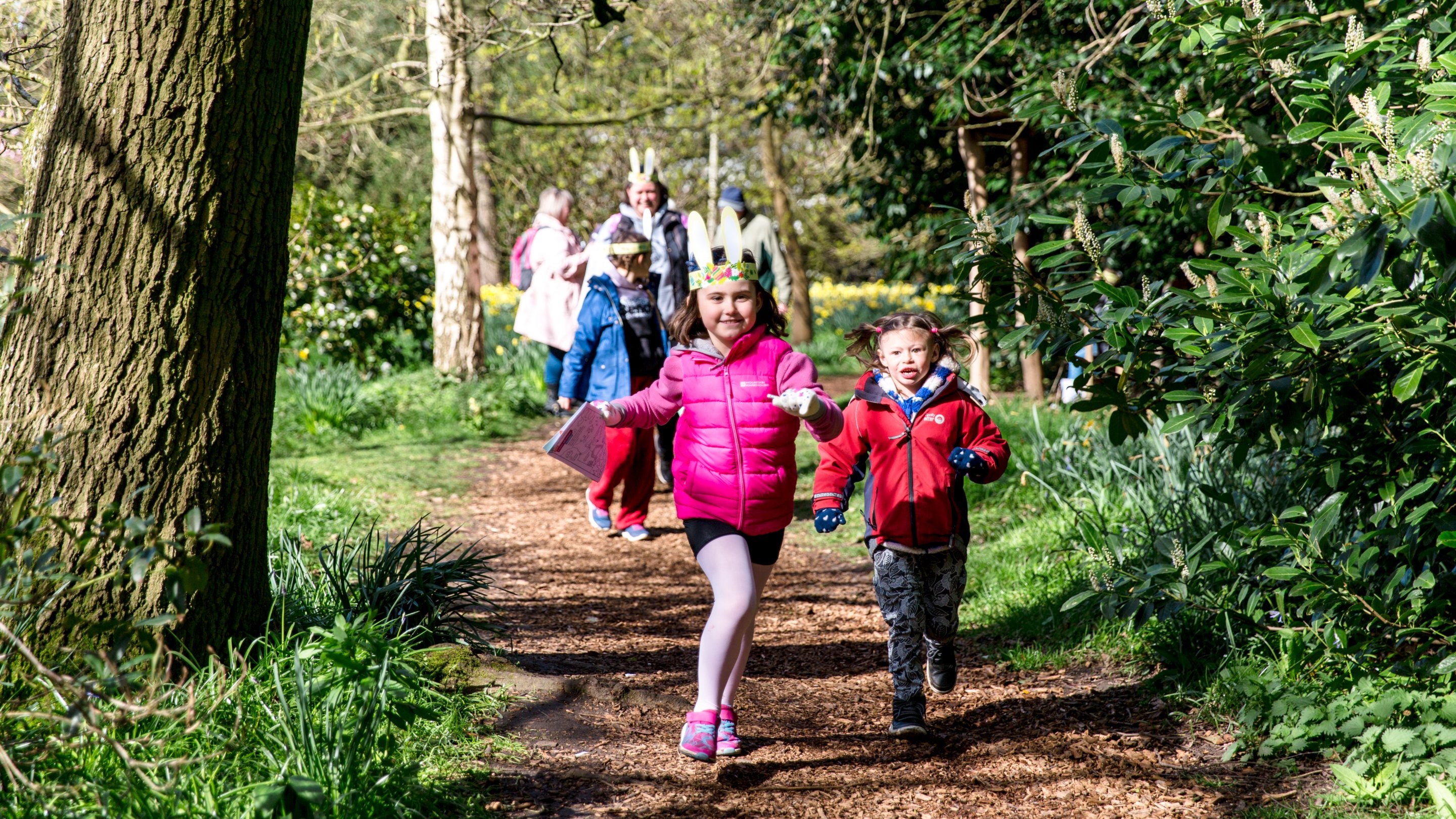 A family with young children on the Easter trail at Beningbrough Hall, North Yorkshire