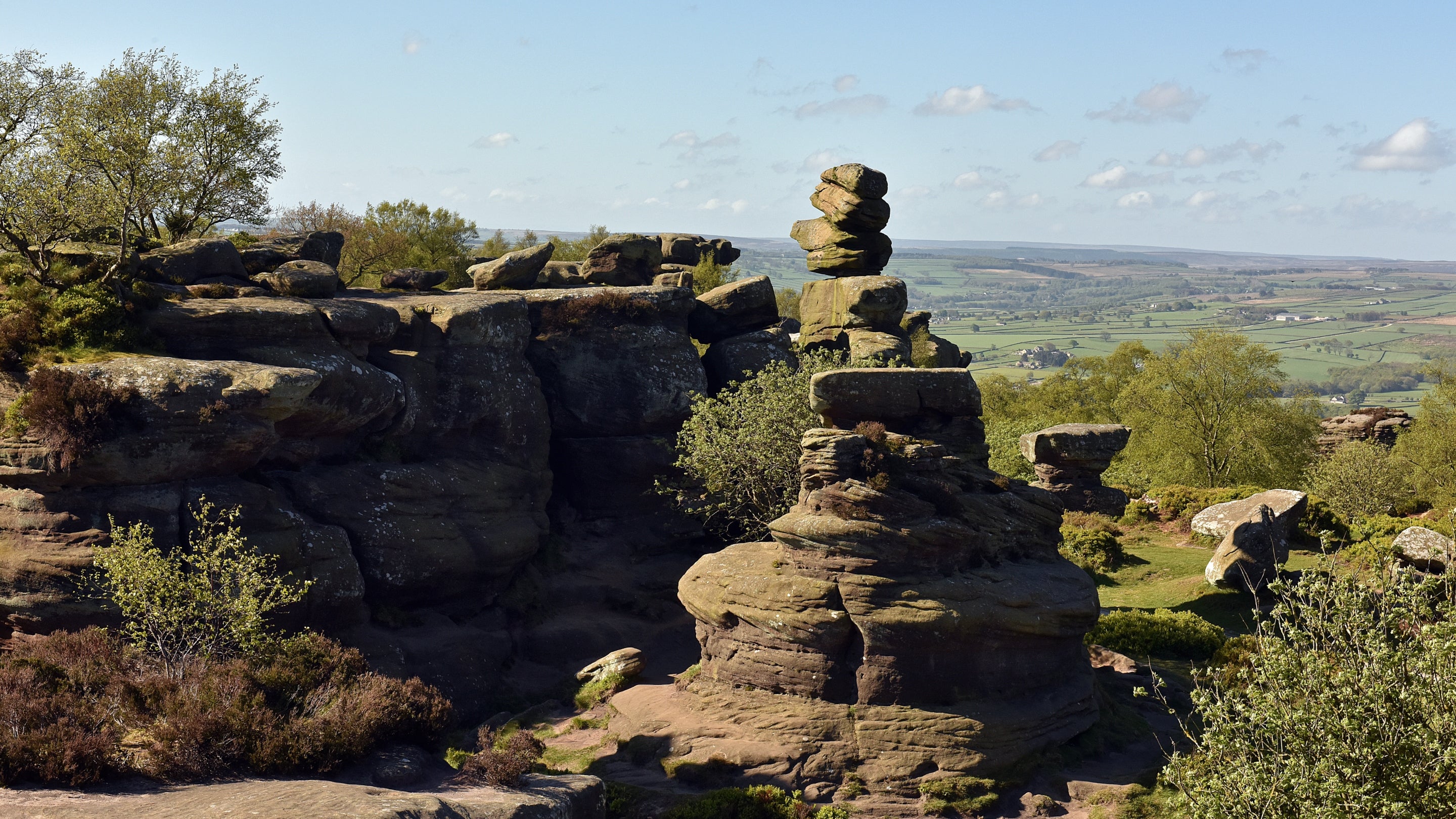 Prehistoric rocks tower above a far-reaching view of the Yorkshire countryside