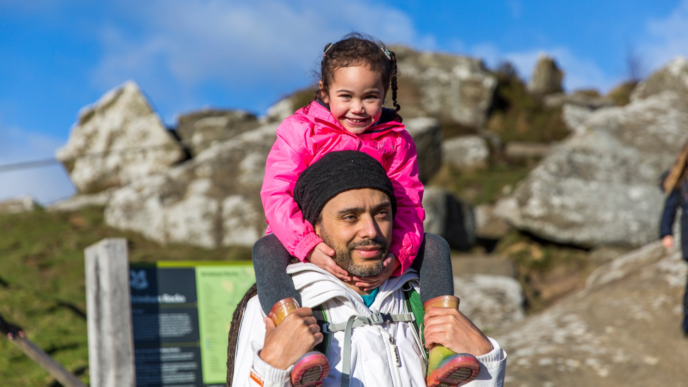 Man carrying a child on his shoulders at Brimham Rocks, Yorkshire