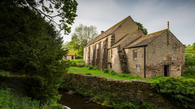 Exterior view of Fountains Mill at Fountains Abbey and Studley Royal Water Garden, Yorkshire.