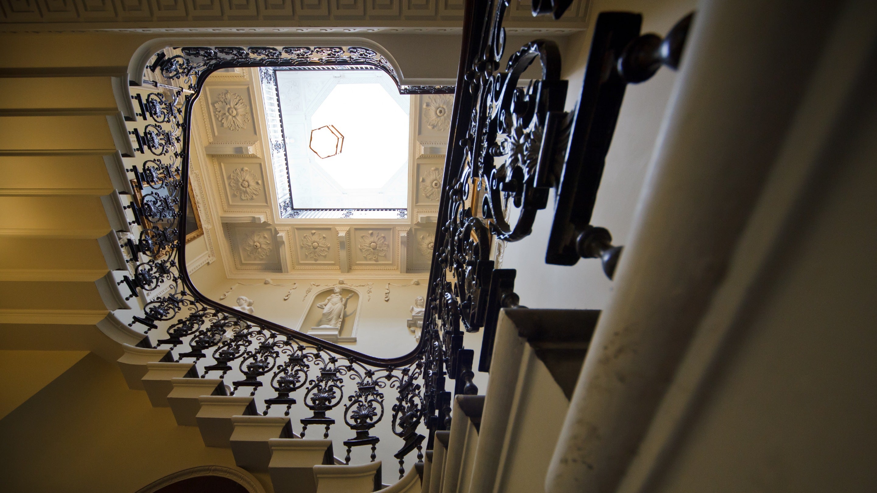 Decorative balustrade circling on the top floor under a sky light, Maister House, Yorkshire