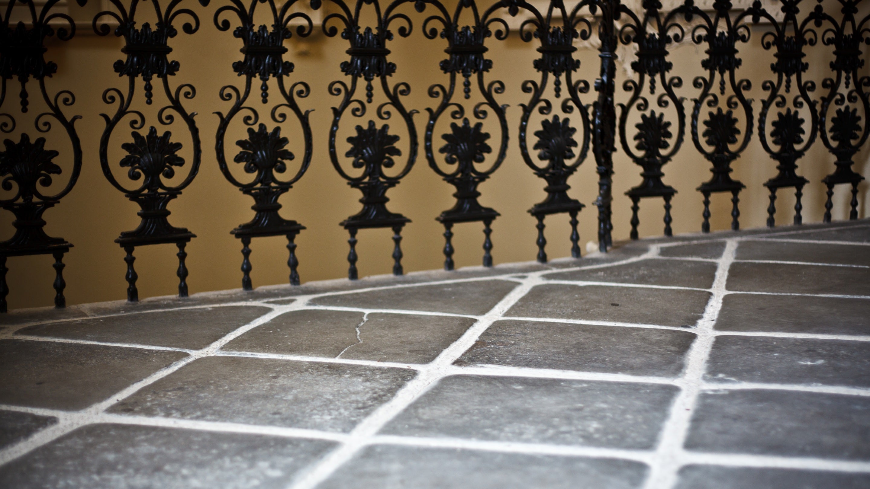 Details of a decorative balustrade and slate floor