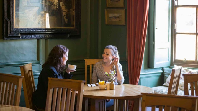 Visitors in the tearoom at Nunnington Hall, North Yorkshire