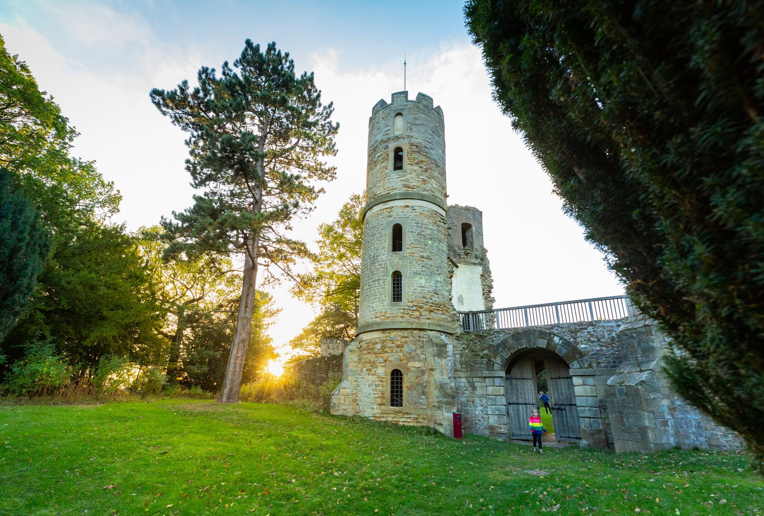 Visitors exploring the gothic folly 'Stainborough Castle' at Wentworth Castle Gardens, South Yorkshire