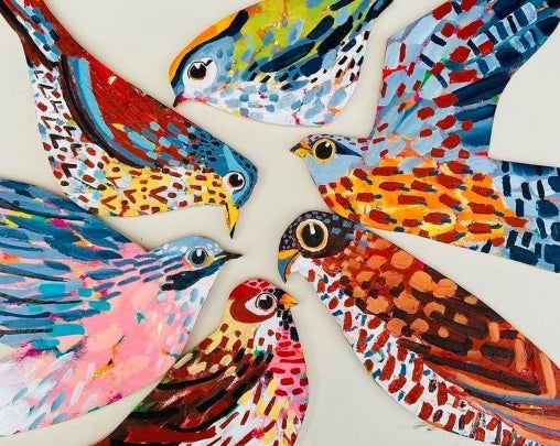 Colourful painted birds created by artist Claire West