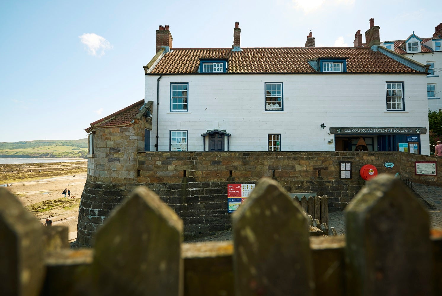 National Trust's Old Coastguard Station at The Dock in Robin Hood's Bay in summer