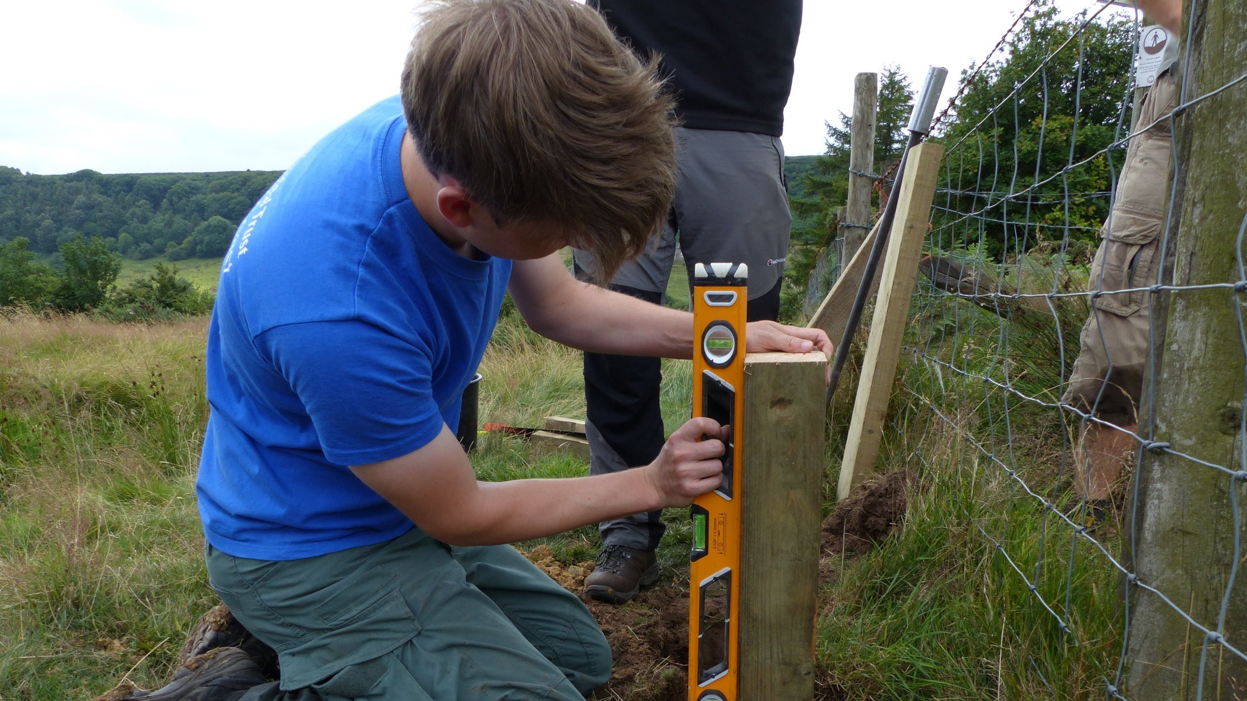 Ranger repairing a stile at Yorkshire Coast